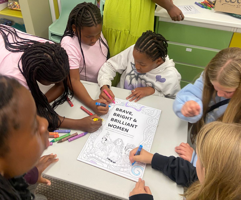 Children participating in interactive African history activities during the Brave, Bright & Brilliant