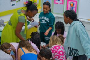 Children participating in interactive African history activities during the Brave, Bright & Brilliant