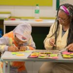 Children participating in interactive African history activities during the Brave, Bright & Brilliant