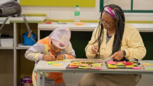 Children participating in interactive African history activities during the Brave, Bright & Brilliant