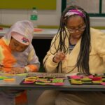 Children participating in interactive African history activities during the Brave, Bright & Brilliant Women book launch.