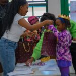Children participating in interactive African history activities during the Brave, Bright & Brilliant Women book launch.
